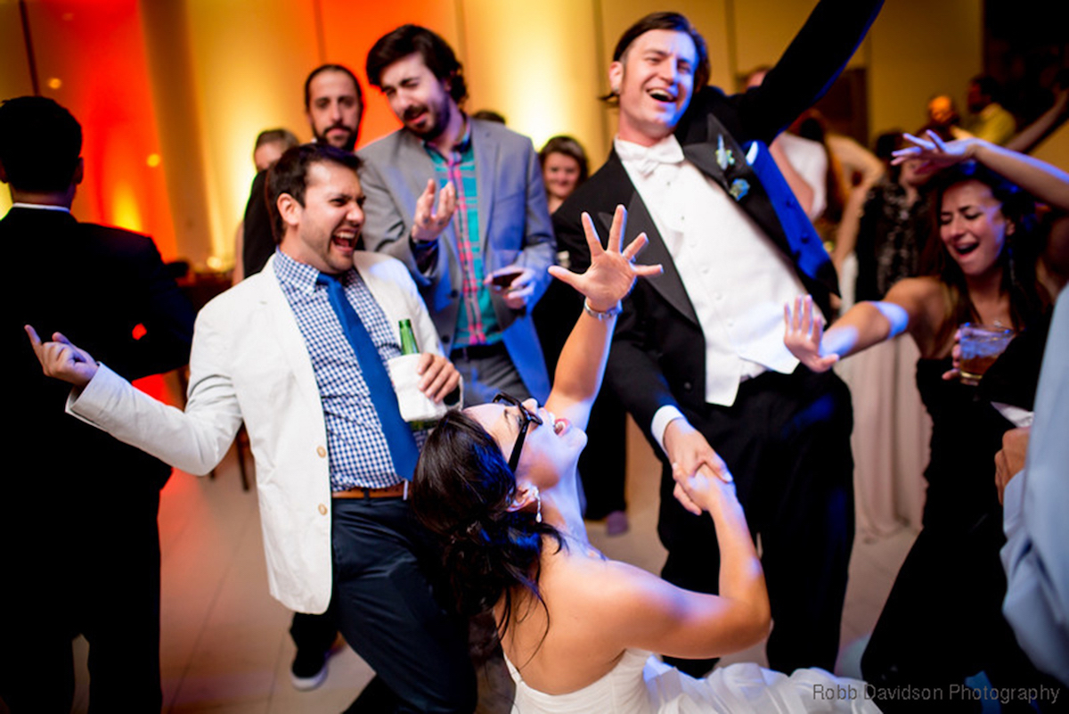 A crowd dancing together at a MusicMasters event