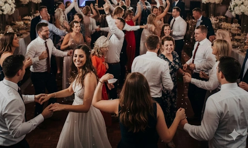 Wedding guests dancing together at a Maryland reception